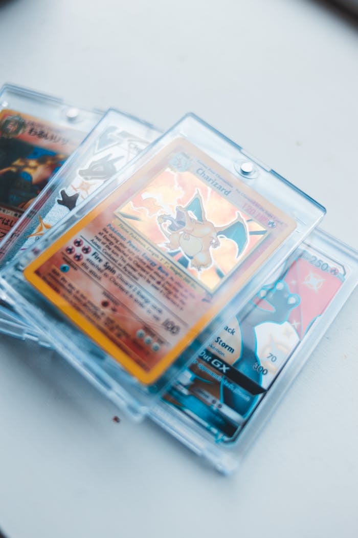 A close-up image of vintage collectible game cards encased in protective sleeves.